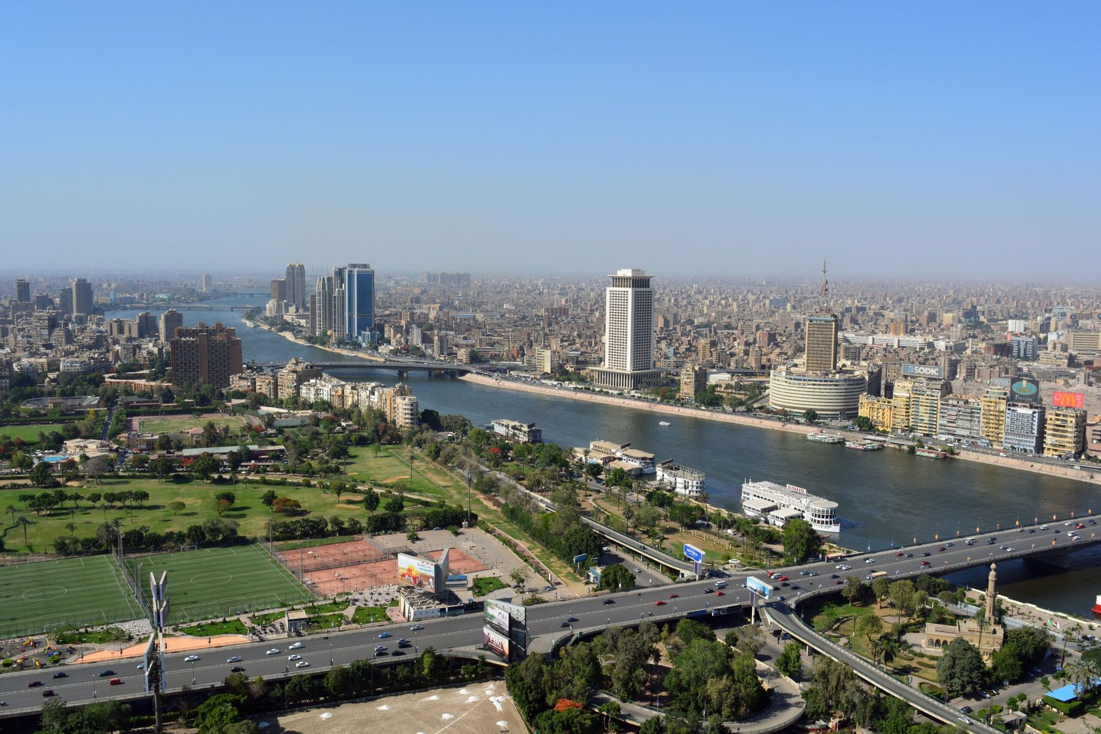 Stunning aerial view of Cairo's skyline along the Nile River on a clear day.